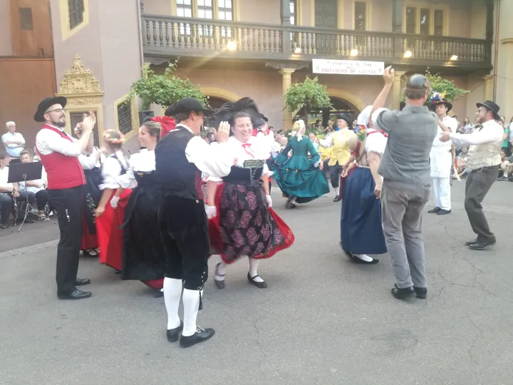 Folklore dancing in the evening at Colmar, Alsace (France)